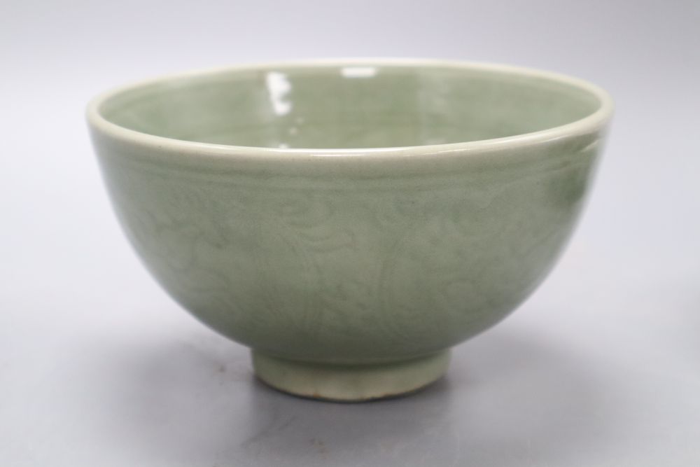 A Chinese celadon bowl, a Thai market famille rose bowl and a crackle glaze bowl